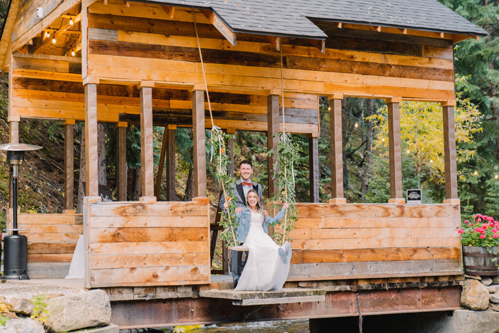 Newlyweds on bridge swing at Blackstone Rivers Ranch
