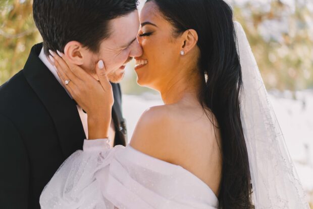 bride groom kiss sunset