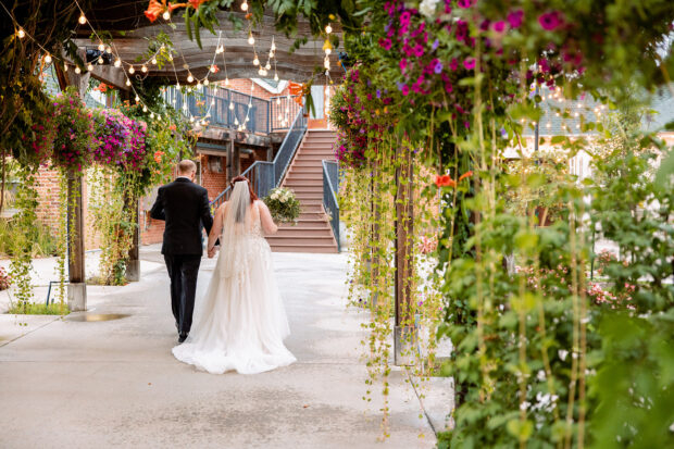 brookside event center bride and groom walking away