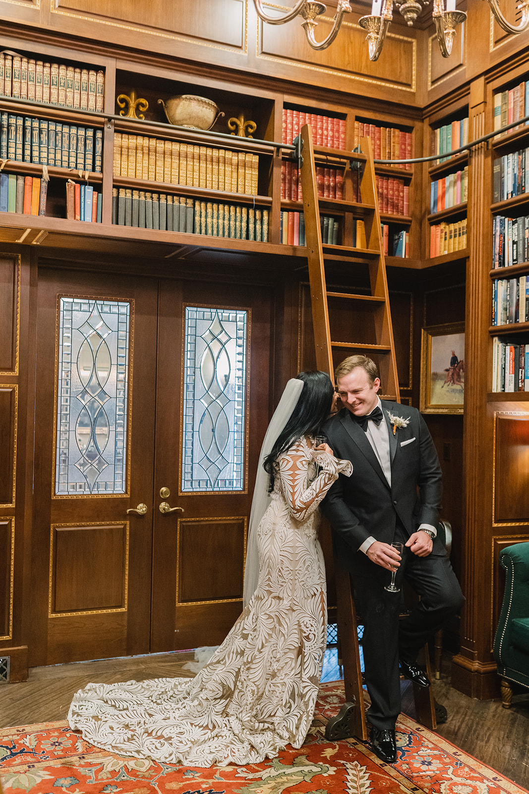 husband and wife chatting in the library at the broadmoor