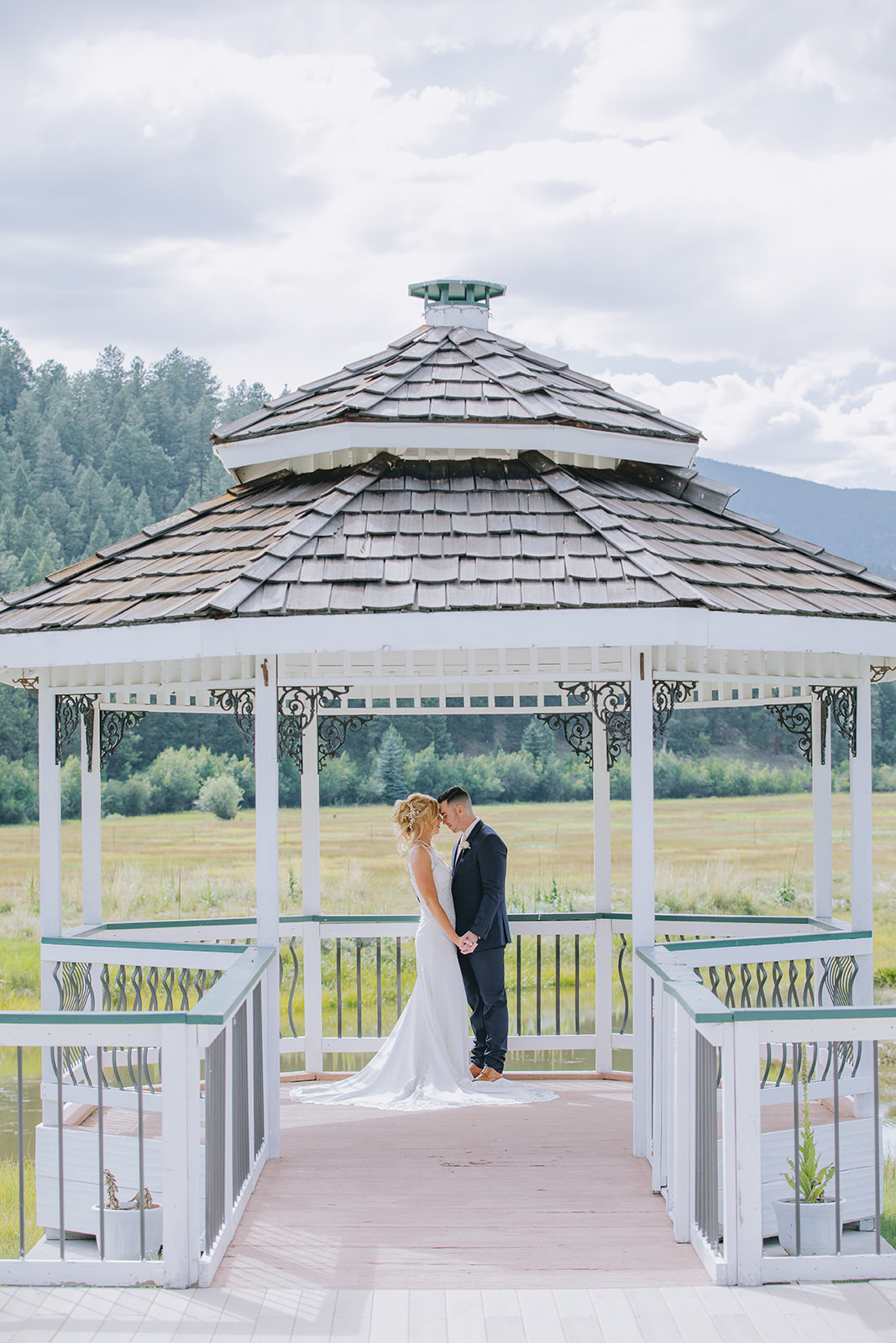 couple underneath gazebo after first look on their wedding day