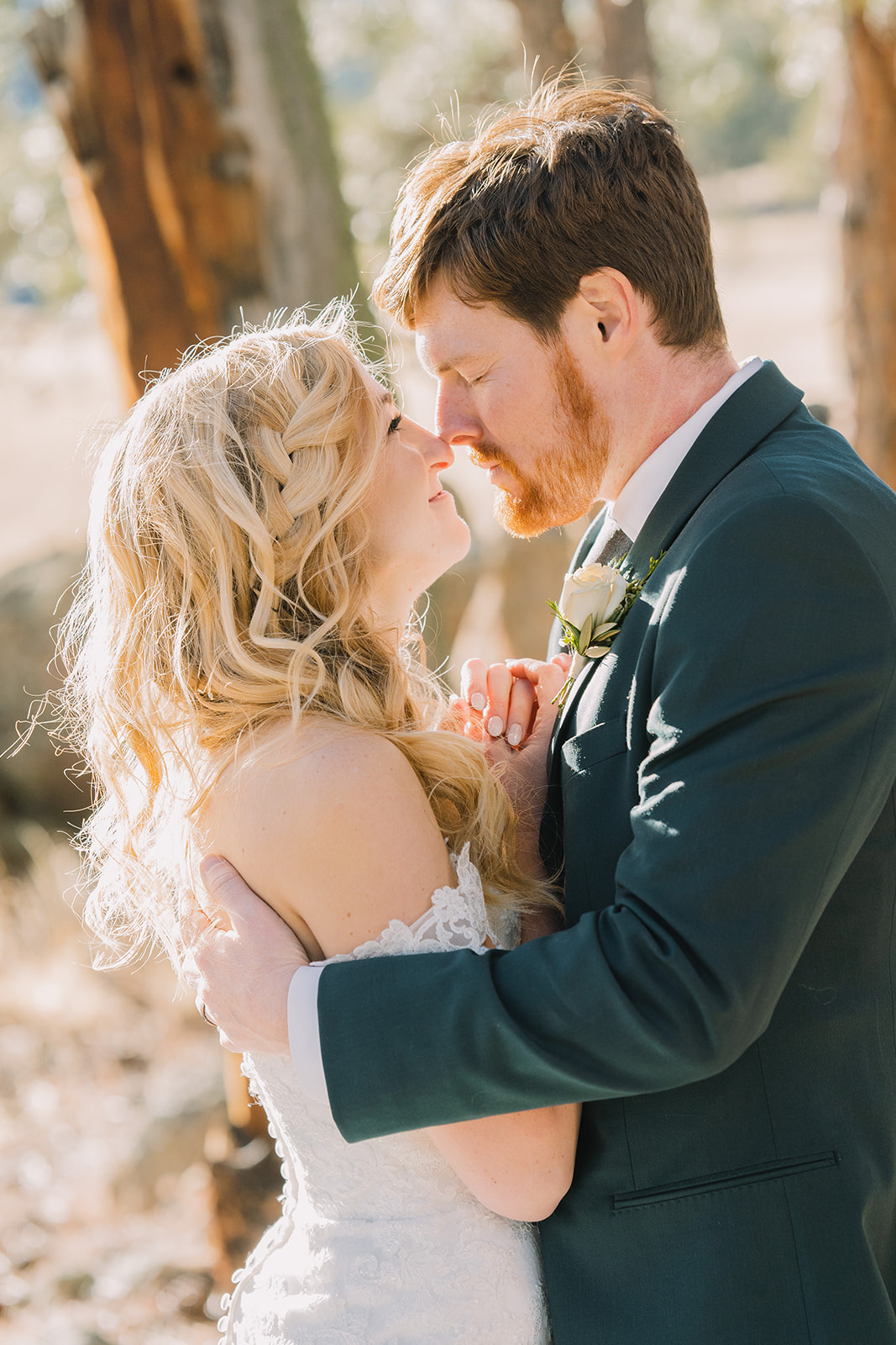 husband and wife doing an eskimo kiss on their wedding day in february
