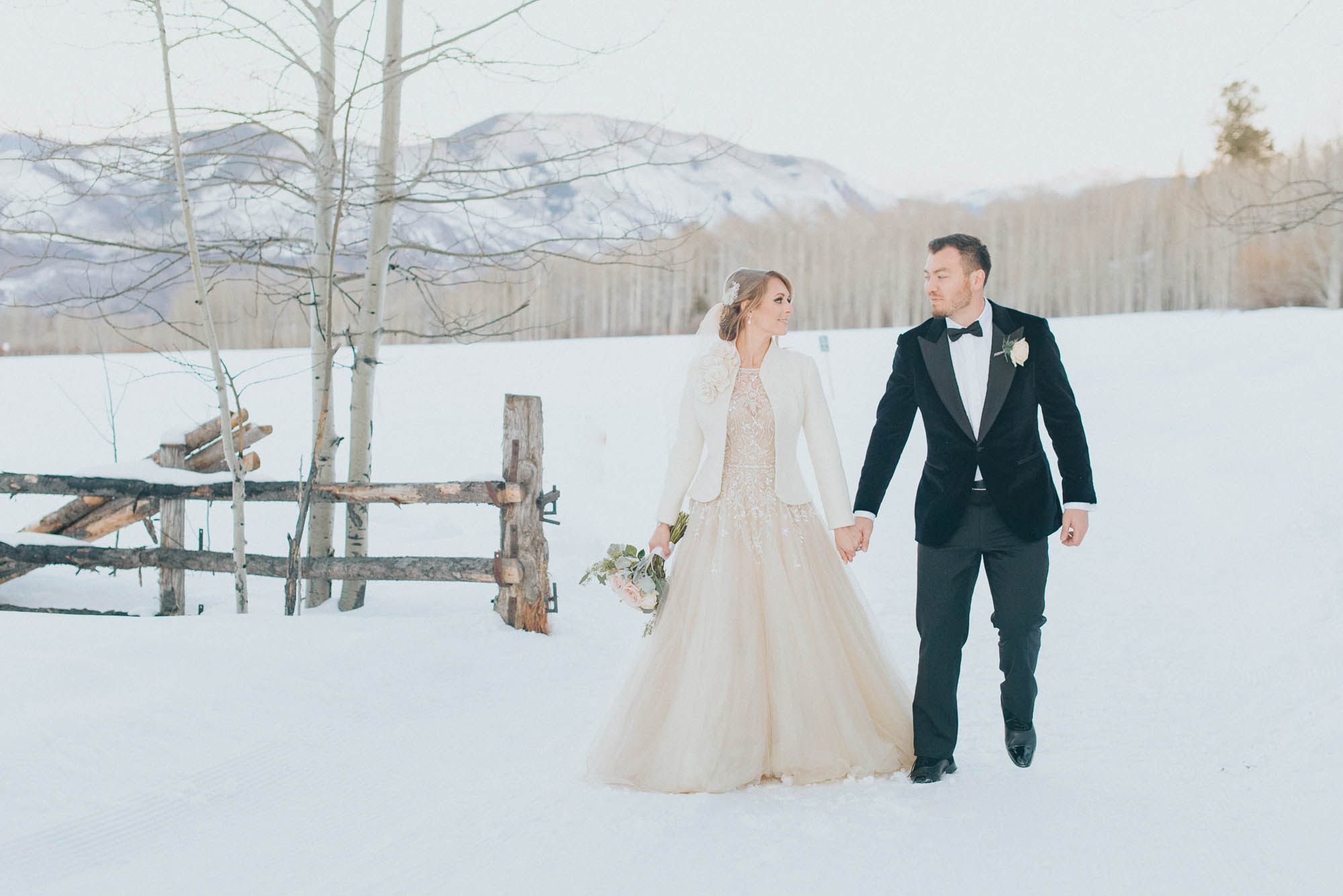 winter mountain wedding blush dress flowers snow