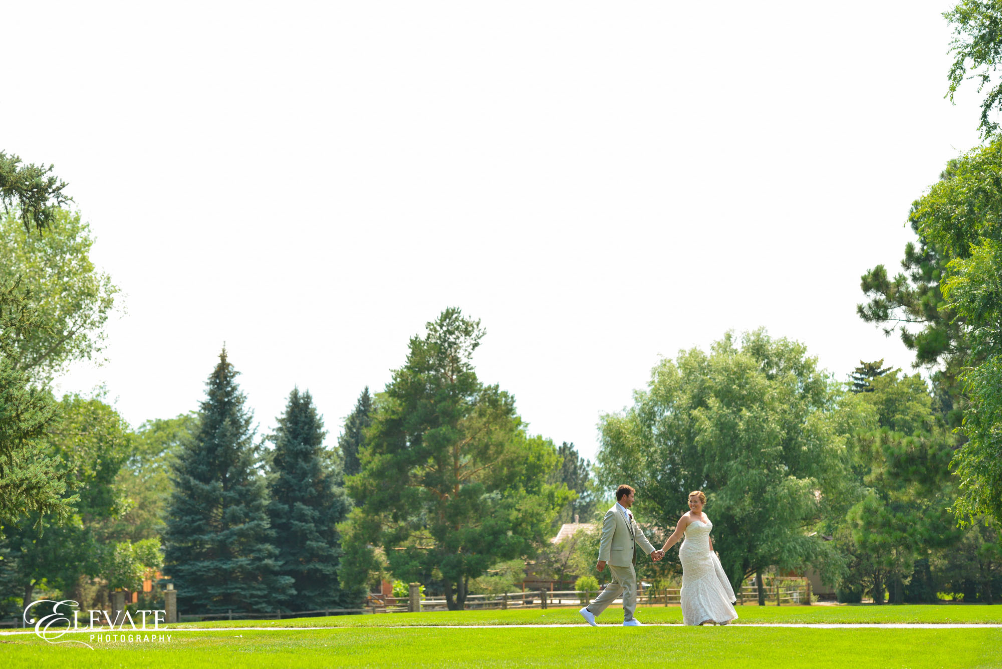 bride and groom on lawn