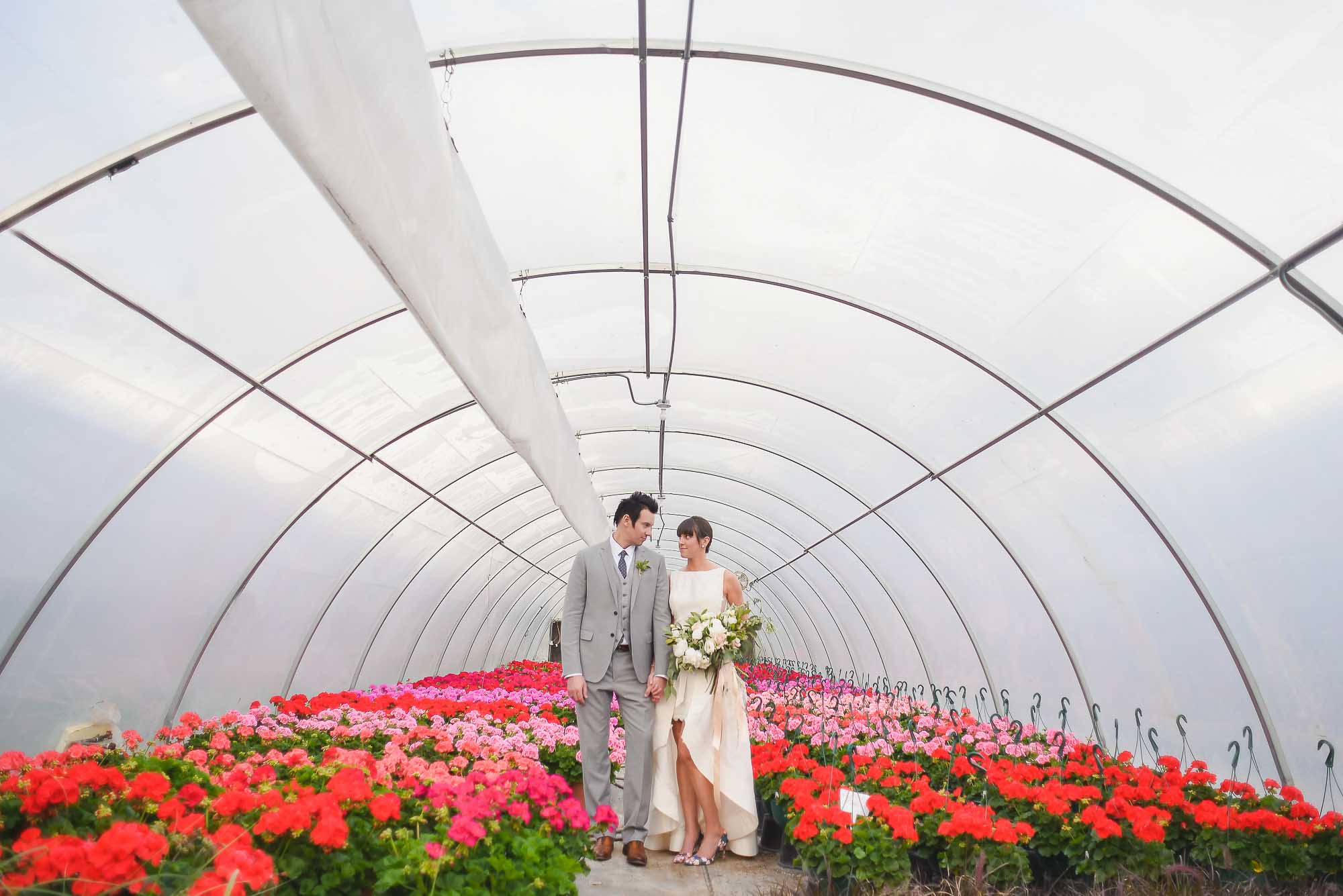Bride and groom in greenhouse